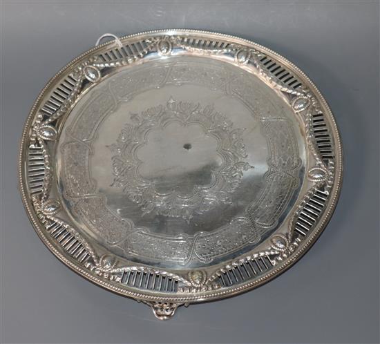 A Victorian engraved silver circular salver, with pierced border, Martin, Hall & Co, London, 1875 (a.f.), 18.5 oz.